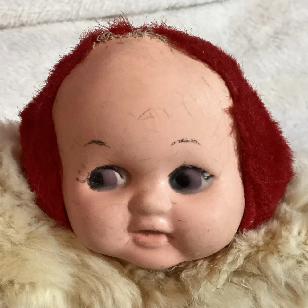 Vintage Creepy Looking Child's Hand Warmer with a Doll Head Attached